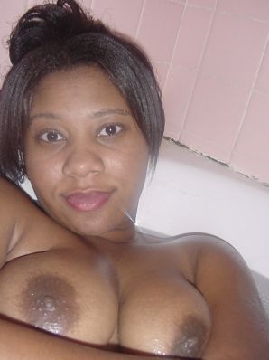 The mulatto pulls her boobs, and then spreads her legs. Thumb 38