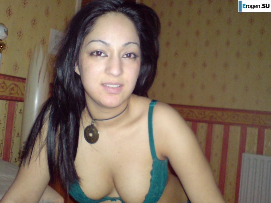 An Asian woman is lying on a bed in her underwear and showing off her ass. Photo 12