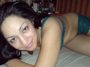 An Asian woman is lying on a bed in her underwear and showing off her ass. Thumb 14