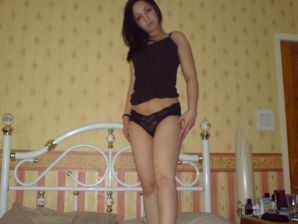 An Asian woman is lying on a bed in her underwear and showing off her ass. Thumb 15