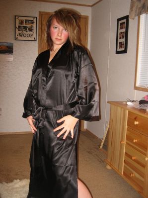 A naked woman is lying on the bed and wrinkling her boobs. Thumb 1