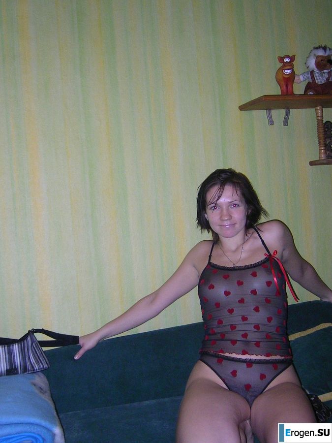 A naughty brunette with small breasts poses at the mirror. Photo 4