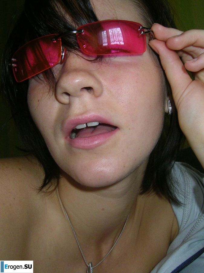 A naughty brunette with small breasts poses at the mirror. Photo 9