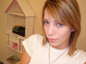 A young girl spread her legs and fingers her wet labia with her fingers. Thumb 1