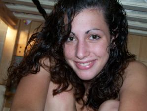 A brunette in a short skirt poses on white sheets. Thumb 45