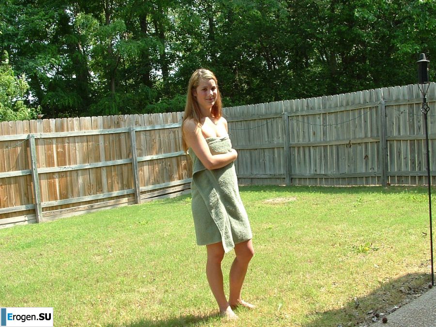 A blonde with a beautiful figure poses naked on the lawn. Part 3. Photo 15