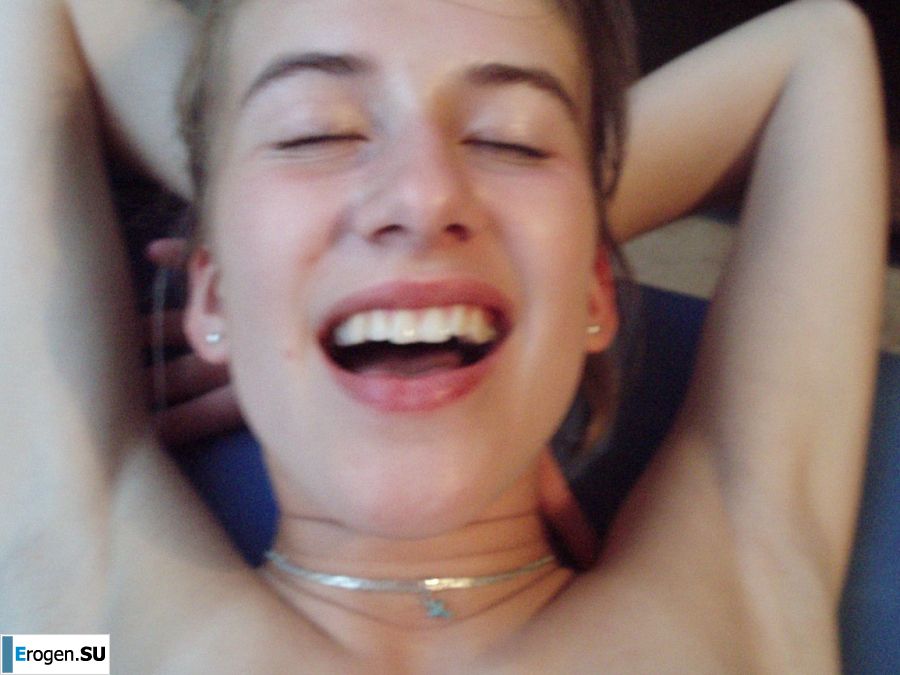 A woman caresses herself spreading her legs apart on the camera. Photo 13