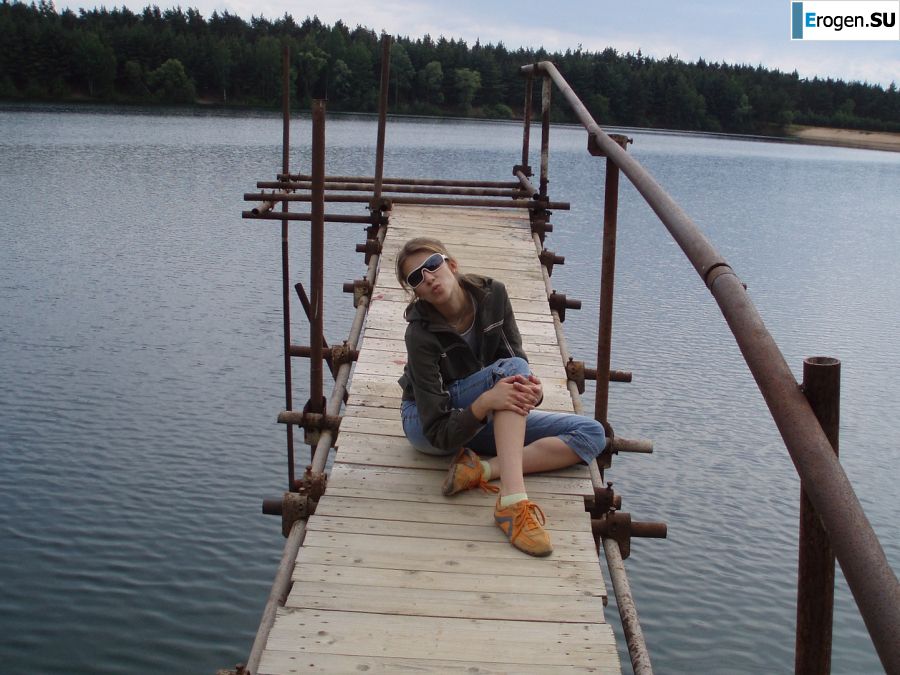 A woman caresses herself spreading her legs apart on the camera. Photo 19