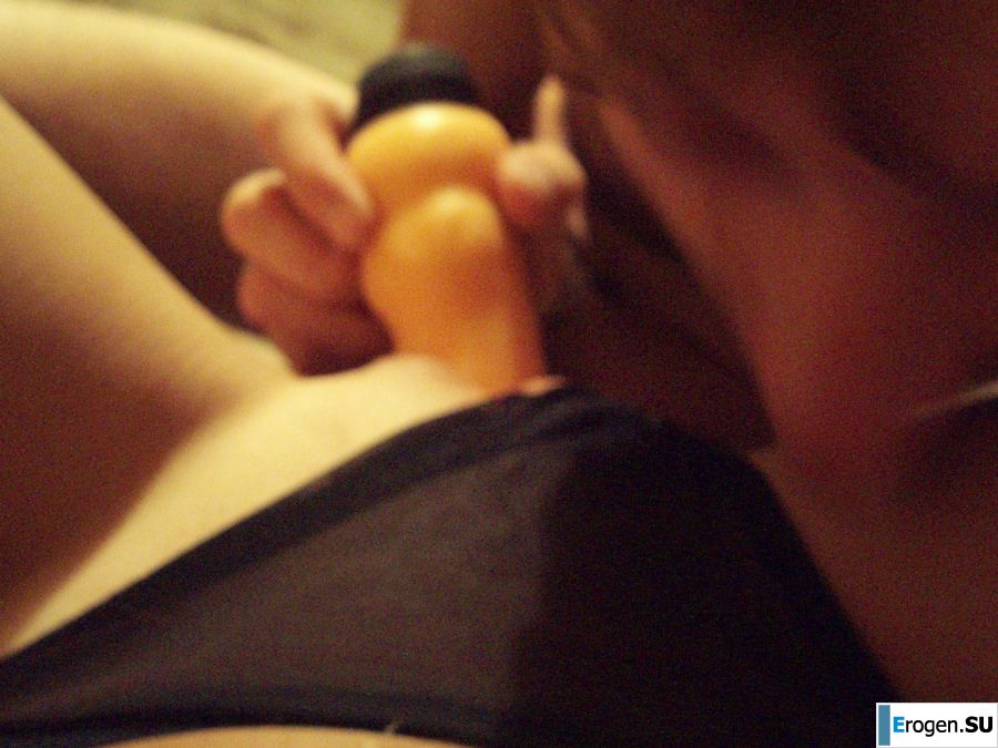 A woman caresses herself spreading her legs apart on the camera. Photo 34