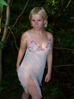 Appetizing magnificent blonde spread her legs right on the grass. Thumb 10