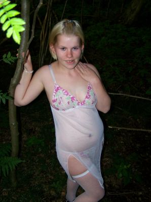 Appetizing magnificent blonde spread her legs right on the grass. Thumb 12