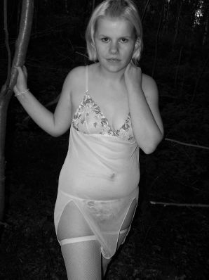 Appetizing magnificent blonde spread her legs right on the grass. Thumb 18