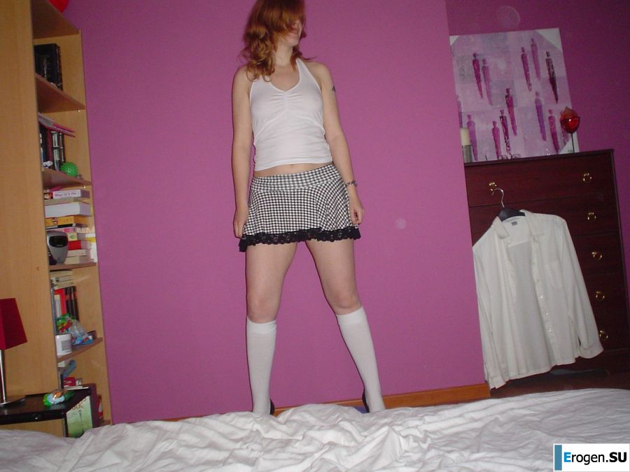 A red-haired student with glasses spread her legs in lace stockings and showed a pussy. Part 2. Photo 32