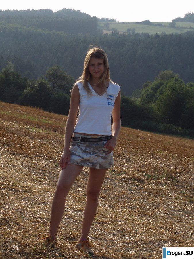 A woman caresses herself spreading her legs apart on the camera. Part 2. Photo 16