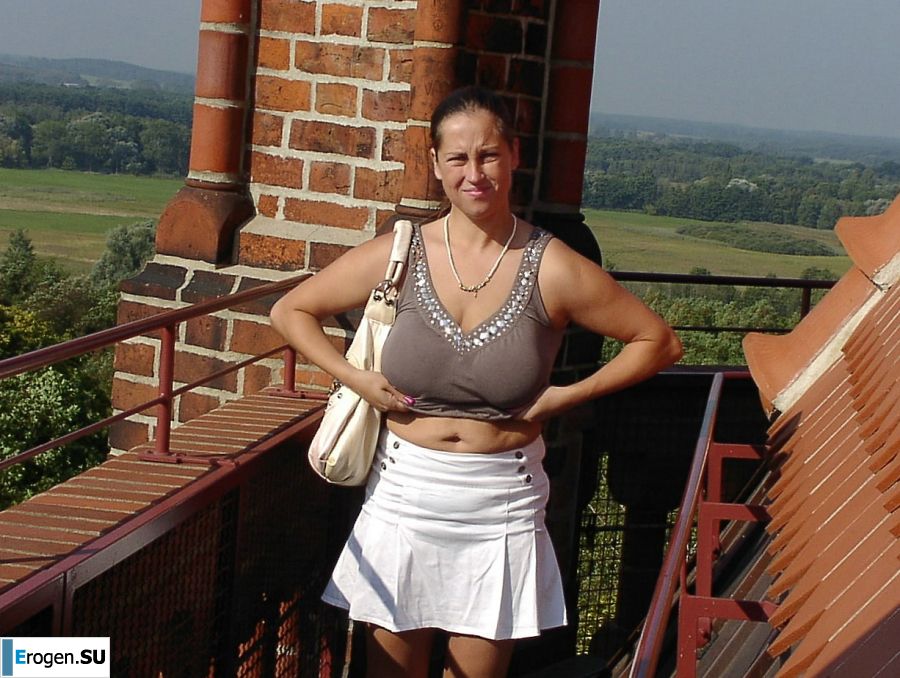 A lush woman bares her tits on the street and takes off her panties. Photo 32